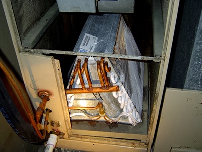 A frozen evaporator coil in an AC system.