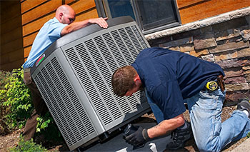 Technicians installing a new unit