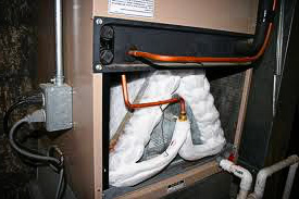 An evaporator freezing because of poor air flow. A frozen evaporator coil.