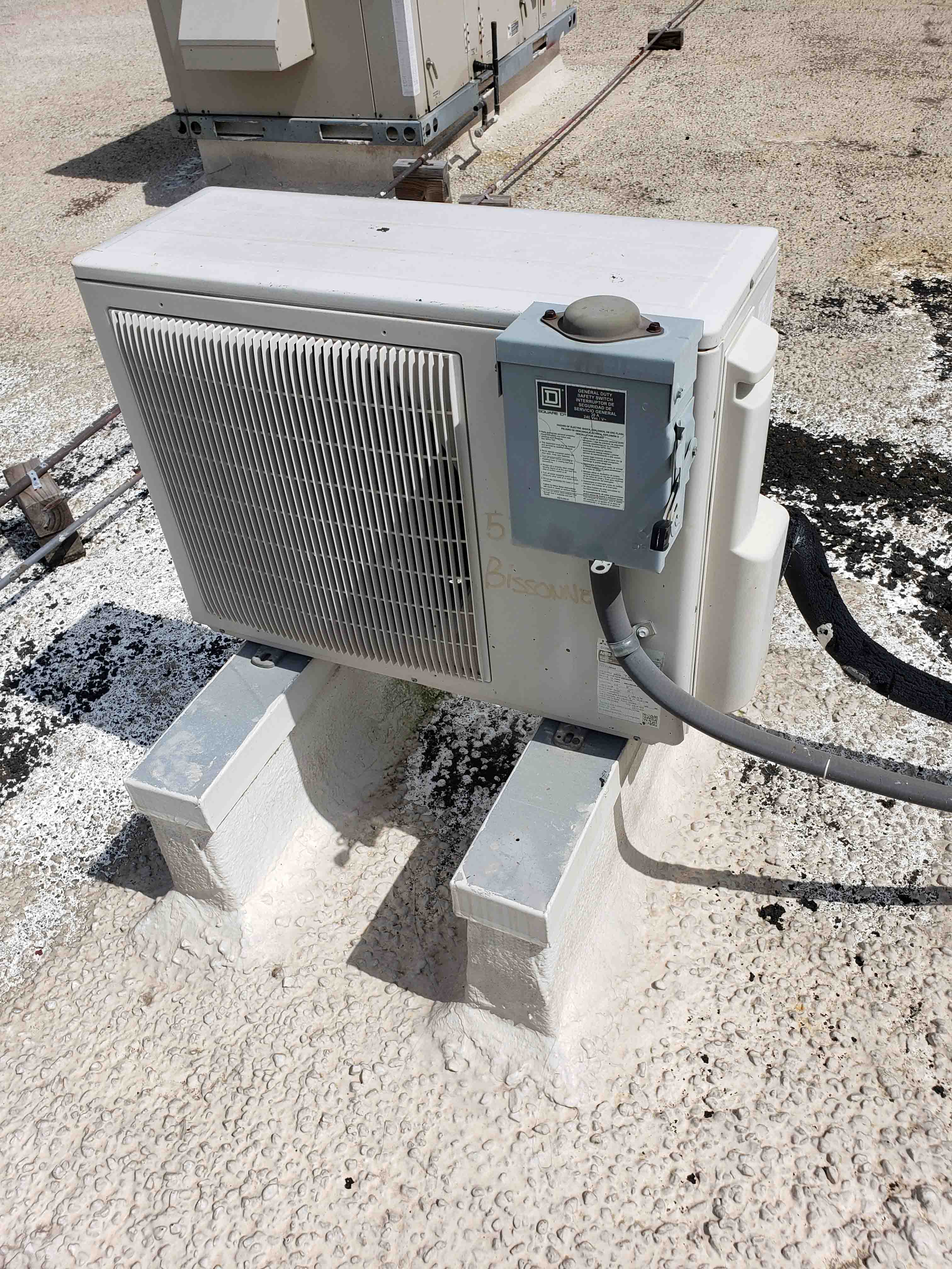 Ductless mini-split AC installation in Houston showing wall-mounted indoor unit and outdoor condenser installation