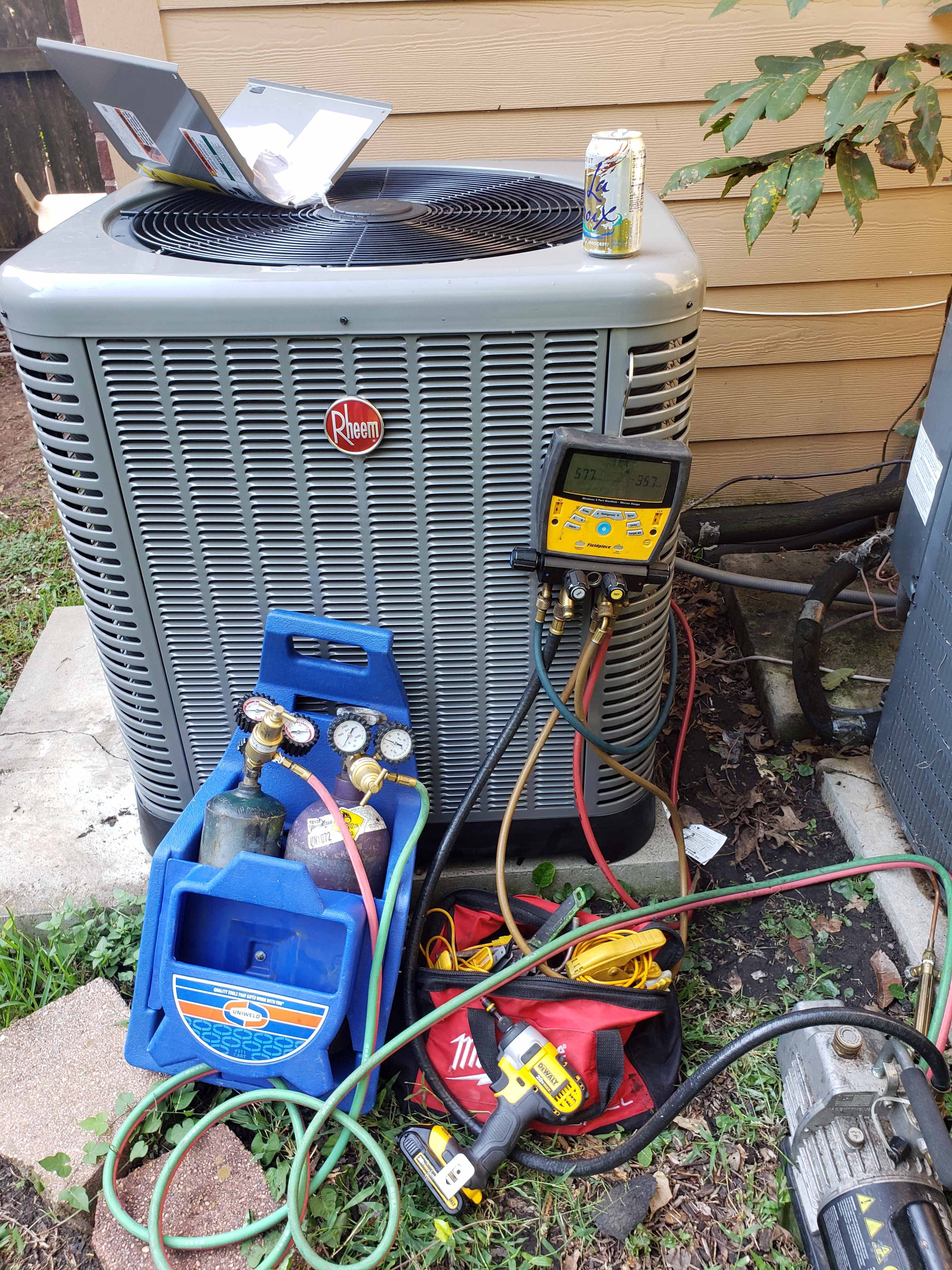 Professional residential AC installation in a Houston home showing central air conditioning unit installation