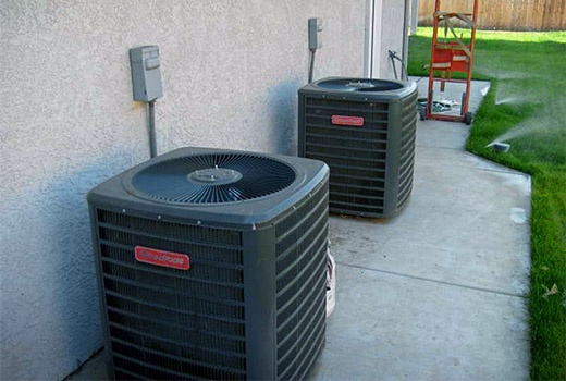 Professional AC installation Fulshear TX - Brand new Goodman condensers installed outside home by Adams Air licensed technicians