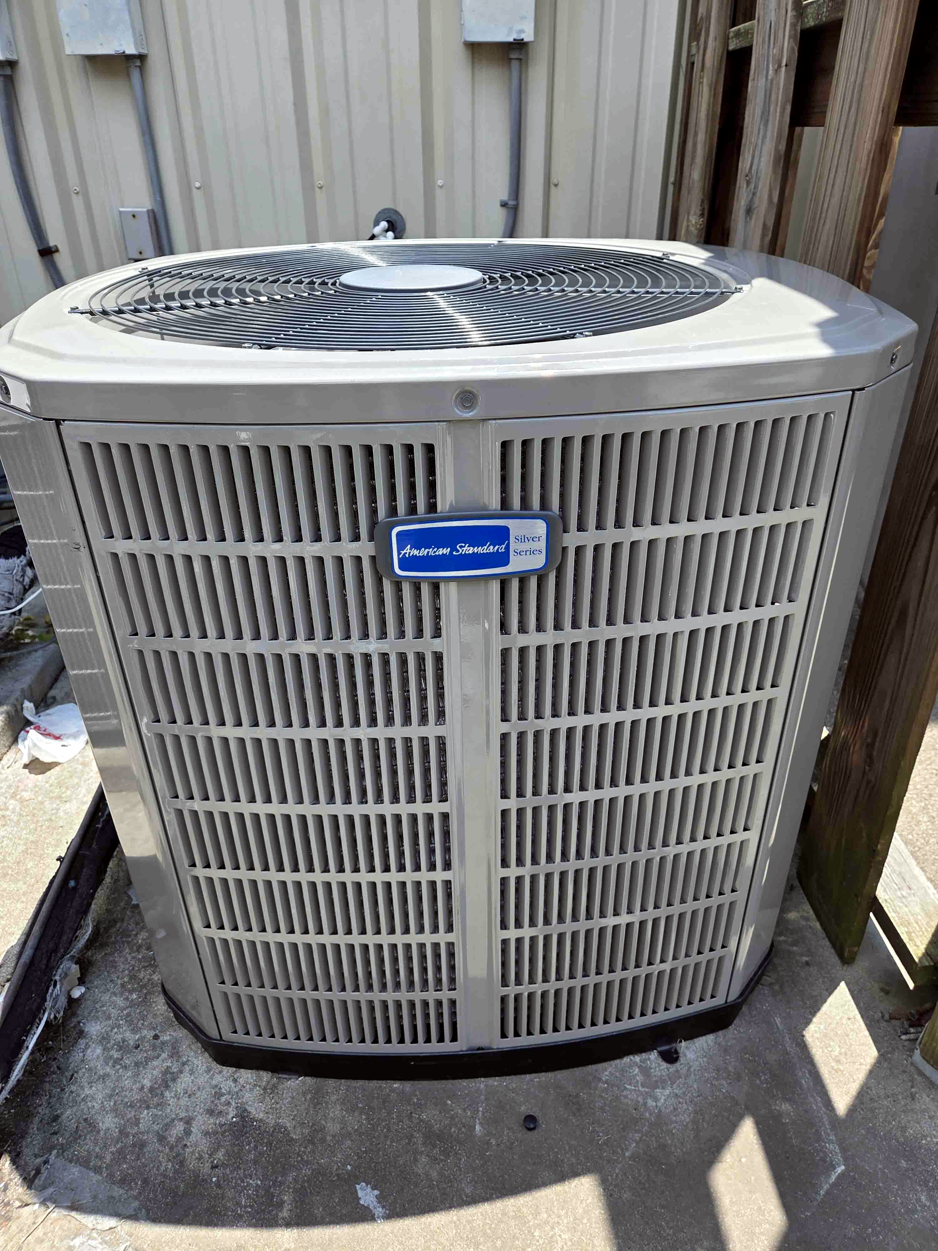 Professional AC installation Houston - 2 new Rheem condensers freshly installed side by side by Adams Air team