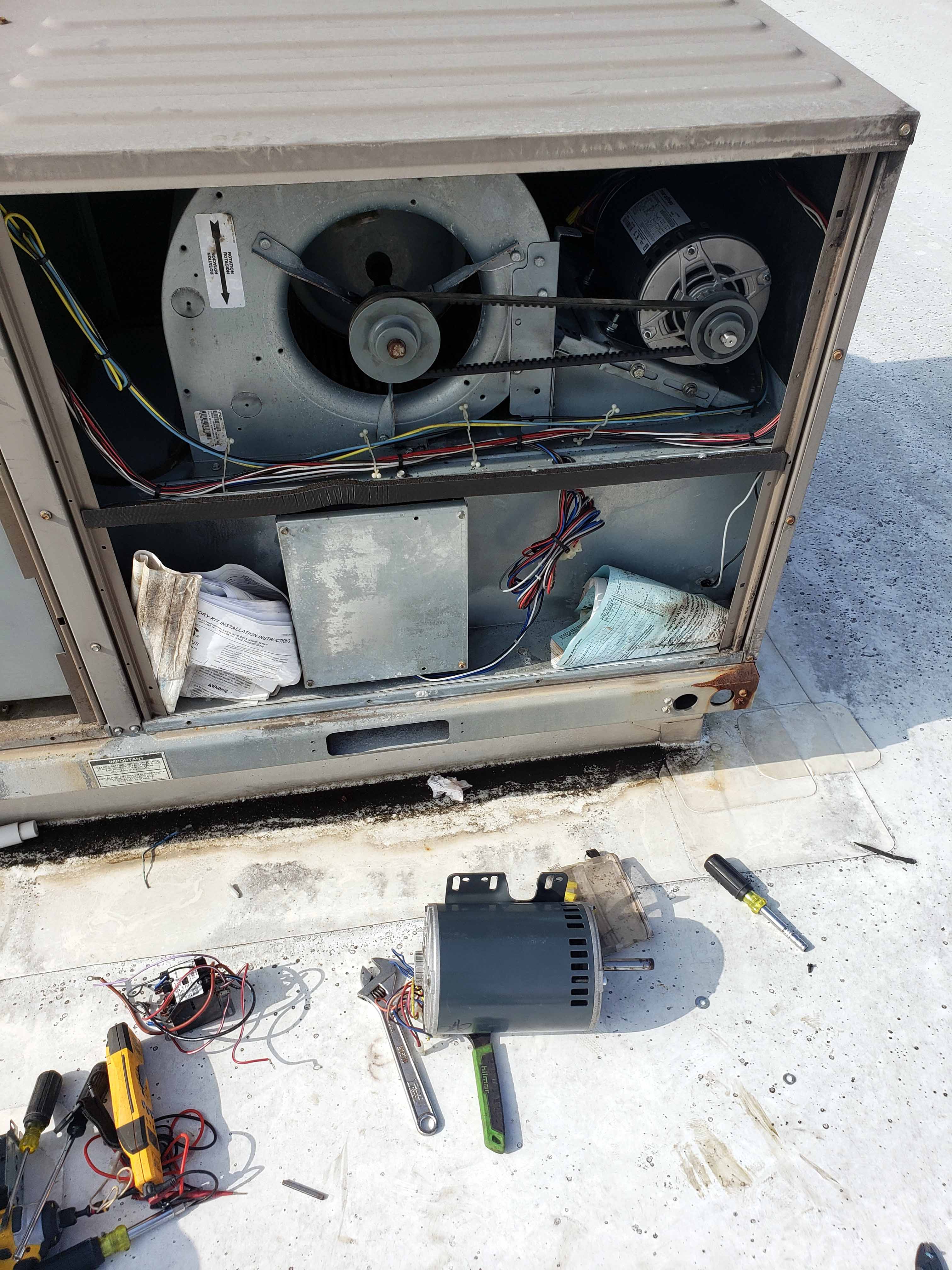 AC repair Houston - Fan motor replacement service being performed by Adams Air certified technician