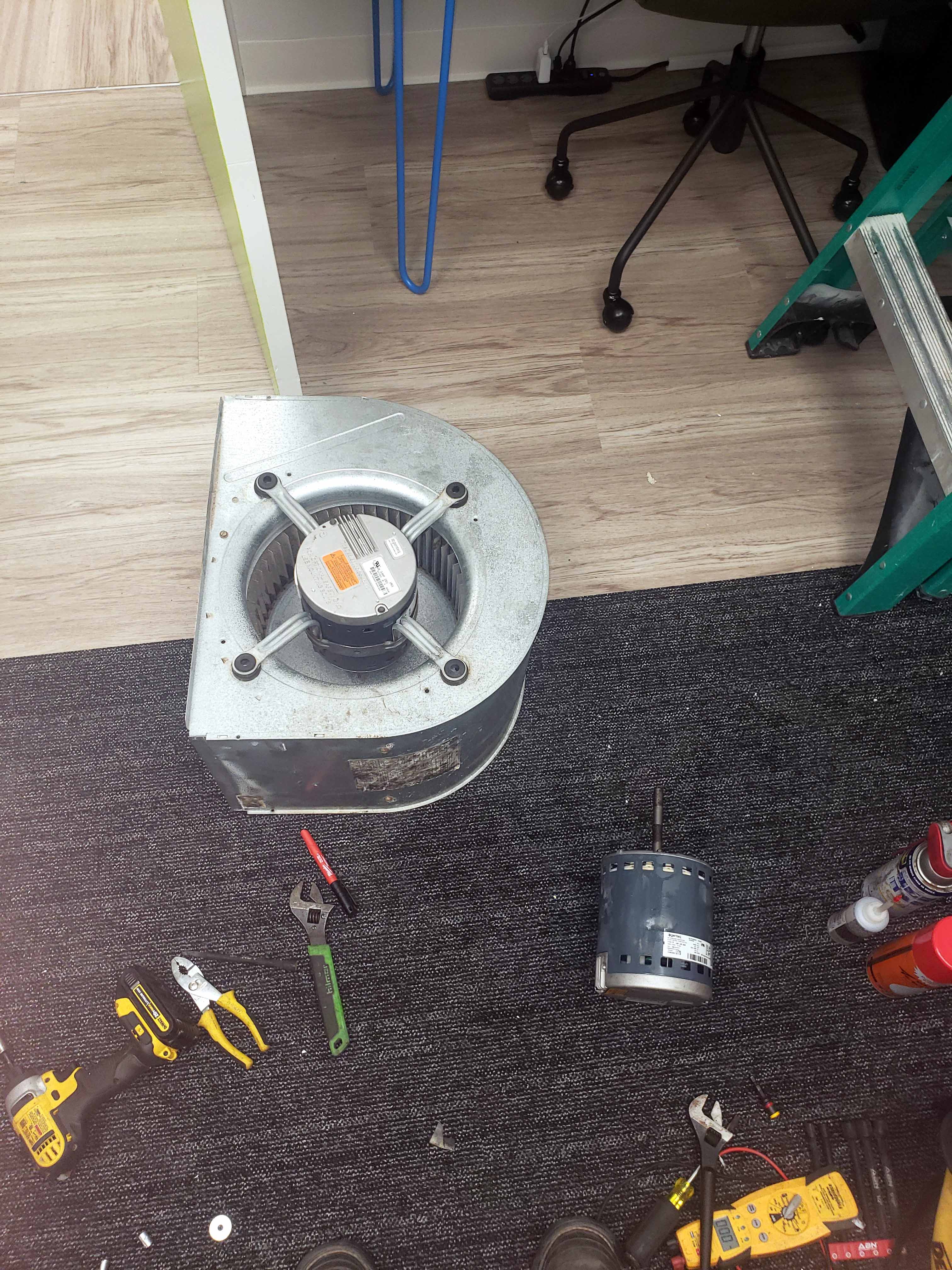 AC repair Houston - Fan motor service and replacement work with professional tools by Adams Air technician
