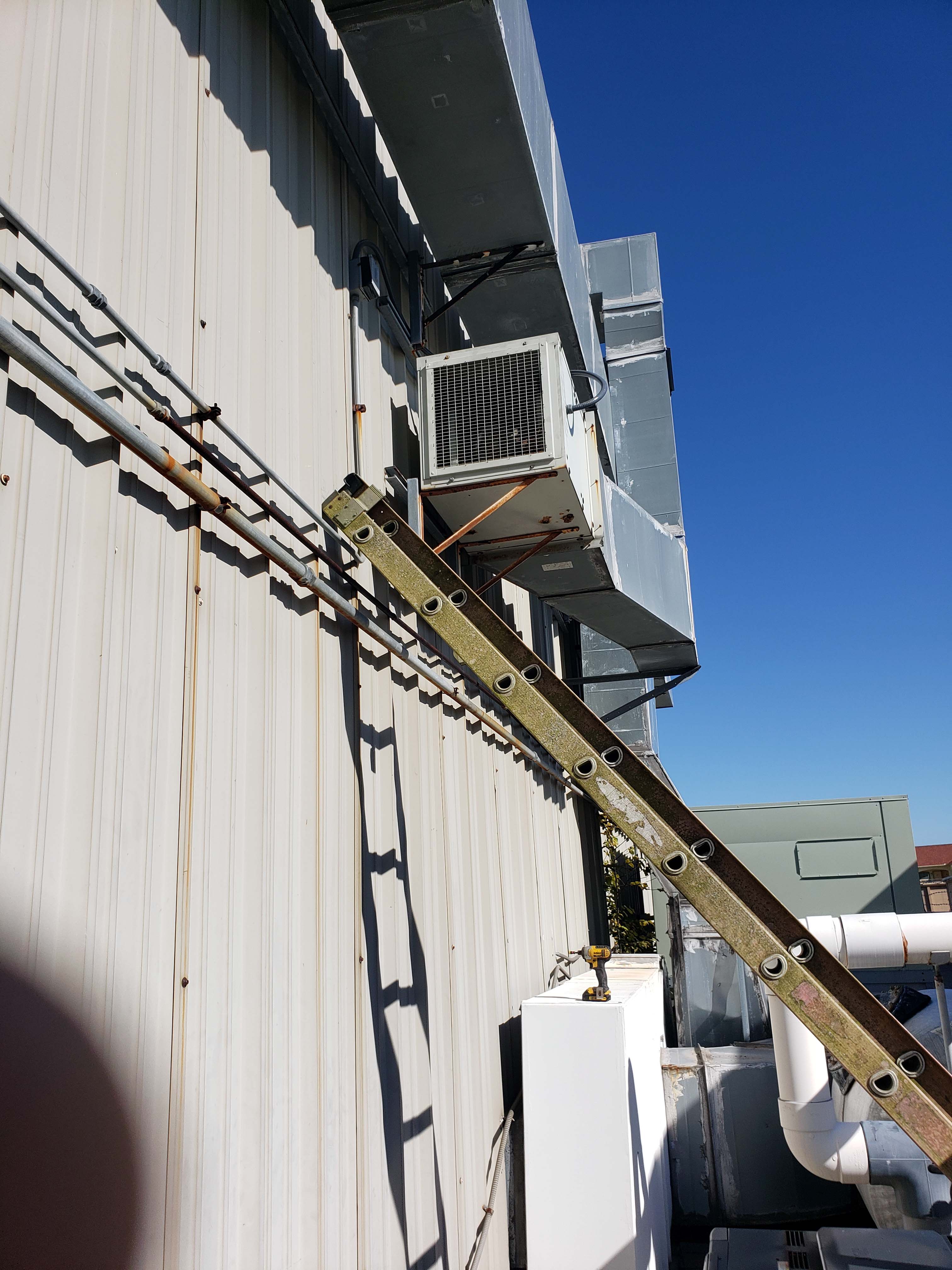 Commercial HVAC Houston - Exhaust fan installation for olympic size pool facility by Adams Air professional team