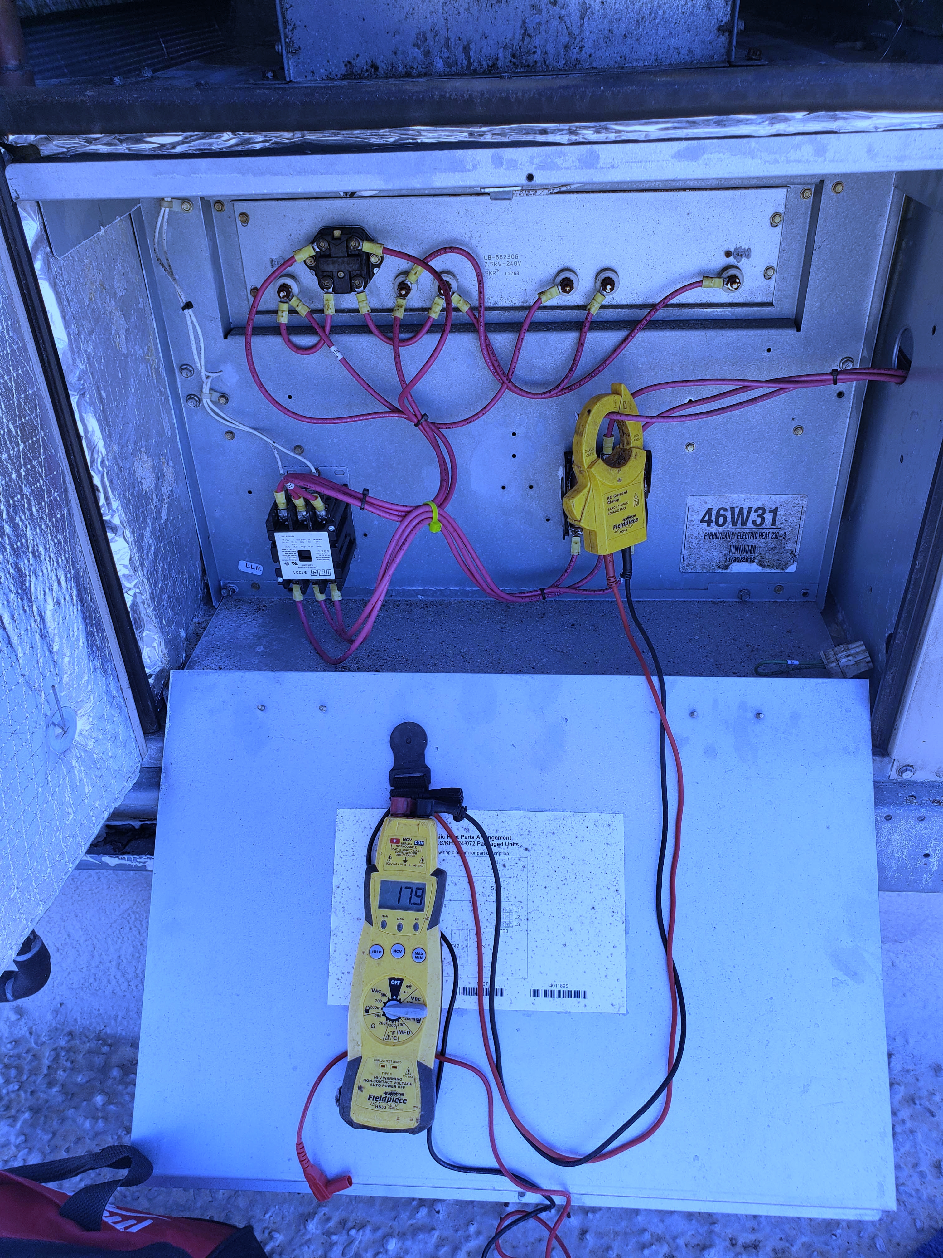 Adams Air HVAC technician in professional uniform approaching heat pump unit for maintenance service